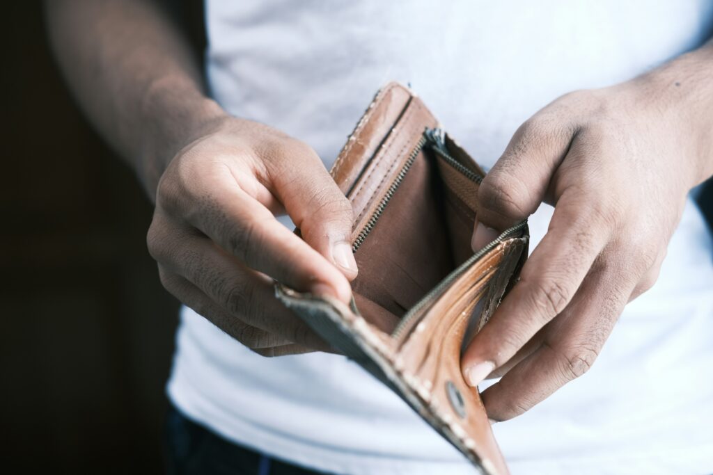 Man holding open a wallet